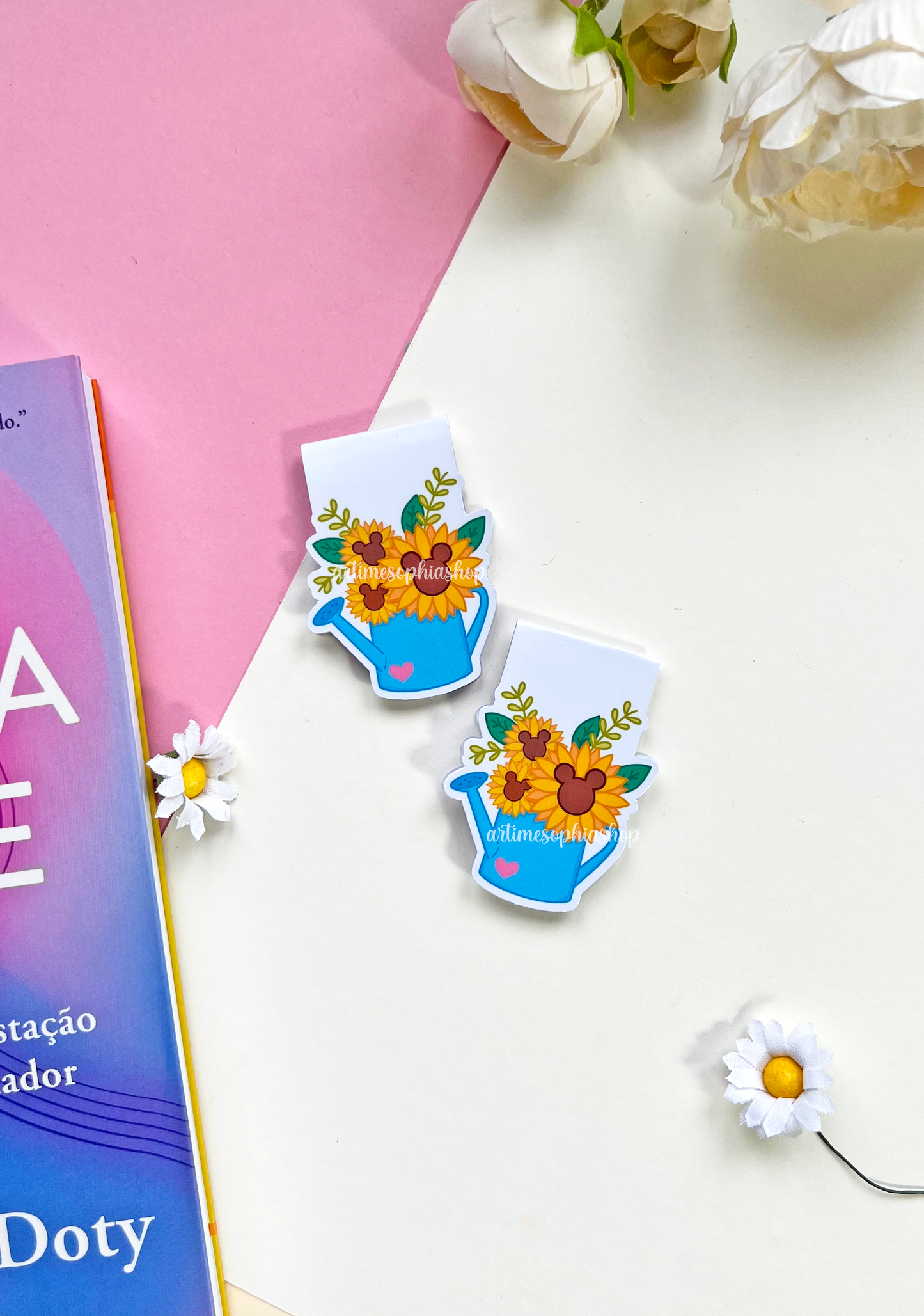 A sunflower-themed magnetic bookmark with hidden Mickey shapes in the flower centers, printed on matte paper with a folded design.