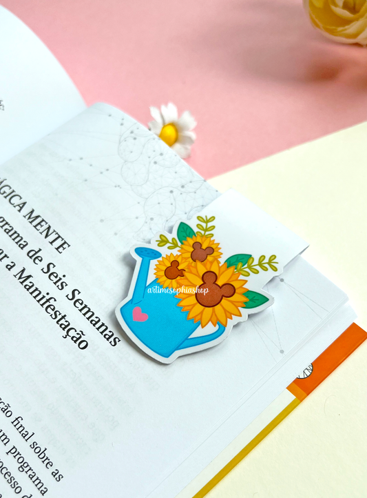 A sunflower-themed magnetic bookmark with hidden Mickey shapes in the flower centers, printed on matte paper with a folded design.