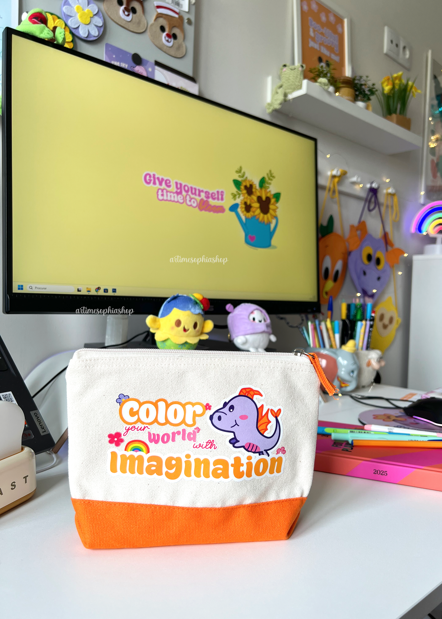 Cotton accessories pouch with a Figment illustration and the quote “Color Your World With Imagination”, featuring a bright orange stripe. Ideal for pens, pencils, and small creative items.