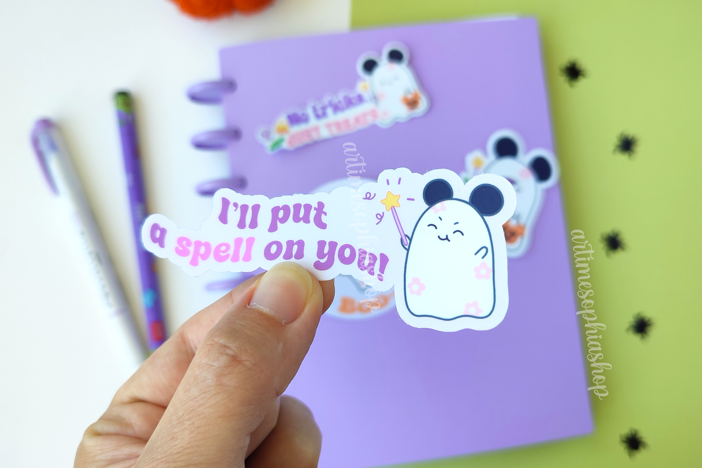 Waterproof Halloween die cut sticker featuring Daisyboo the ghost with the phrase βI'll put a spell on you!β in a cute and magical pastel style.