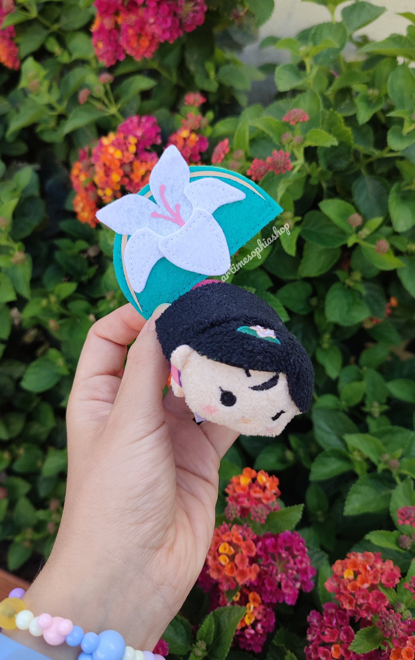 Handmade felt magnolia flower inspired by Mulan, shown in soft pastel tones – perfect as a Disney Bound accessory or decorative magnet.