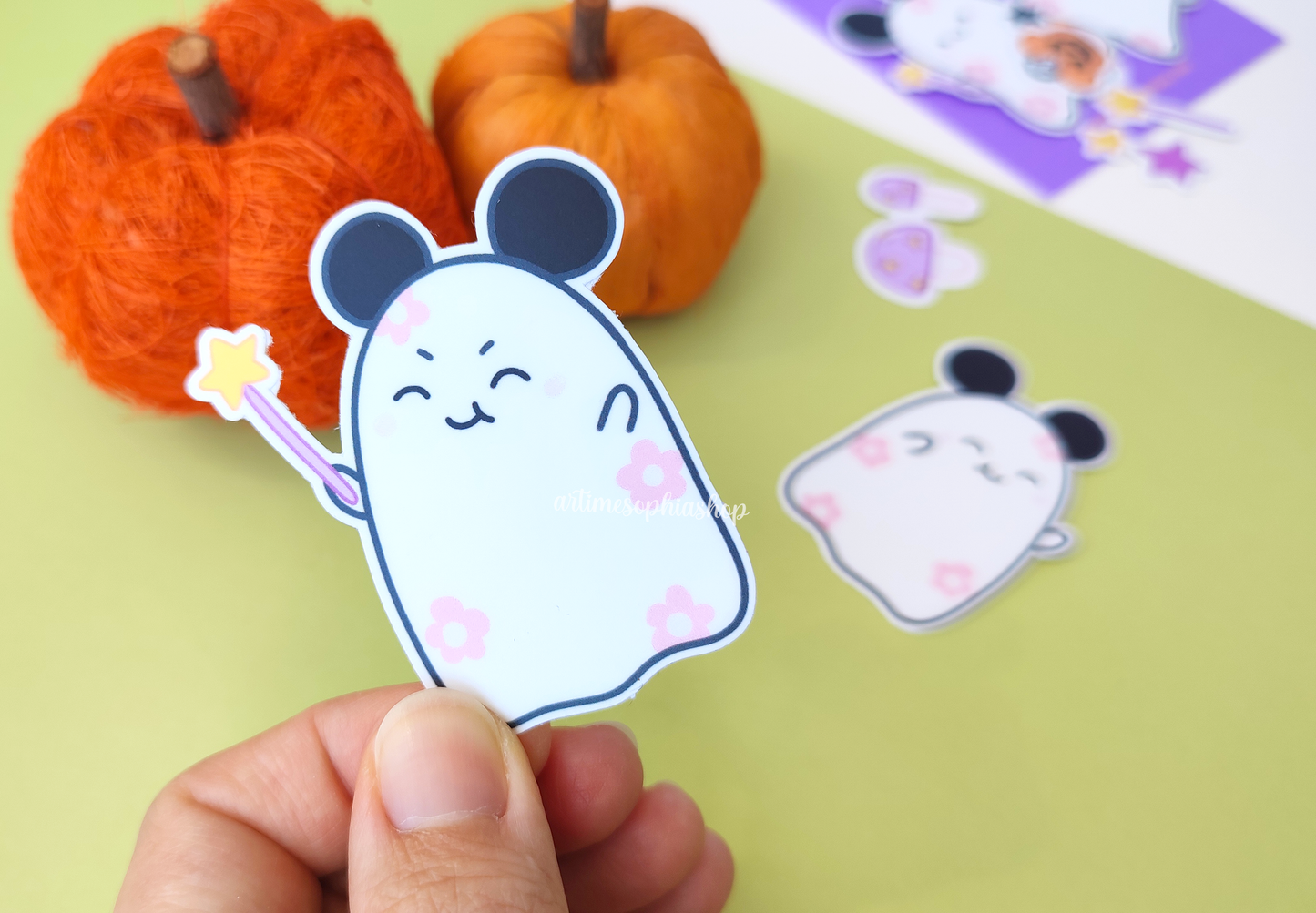 Halloween sticker pack with 14 hand-drawn vinyl stickers featuring Daisyboo the ghost and Pip the bat, printed in a spooky-cute pastel style.