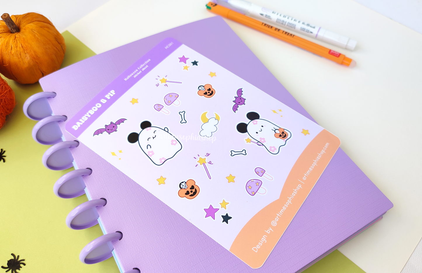 Halloween-themed A6 sticker sheet featuring Daisyboo the ghost and Pip the bat, with colorful, spooky-cute designs printed on matte premium paper.