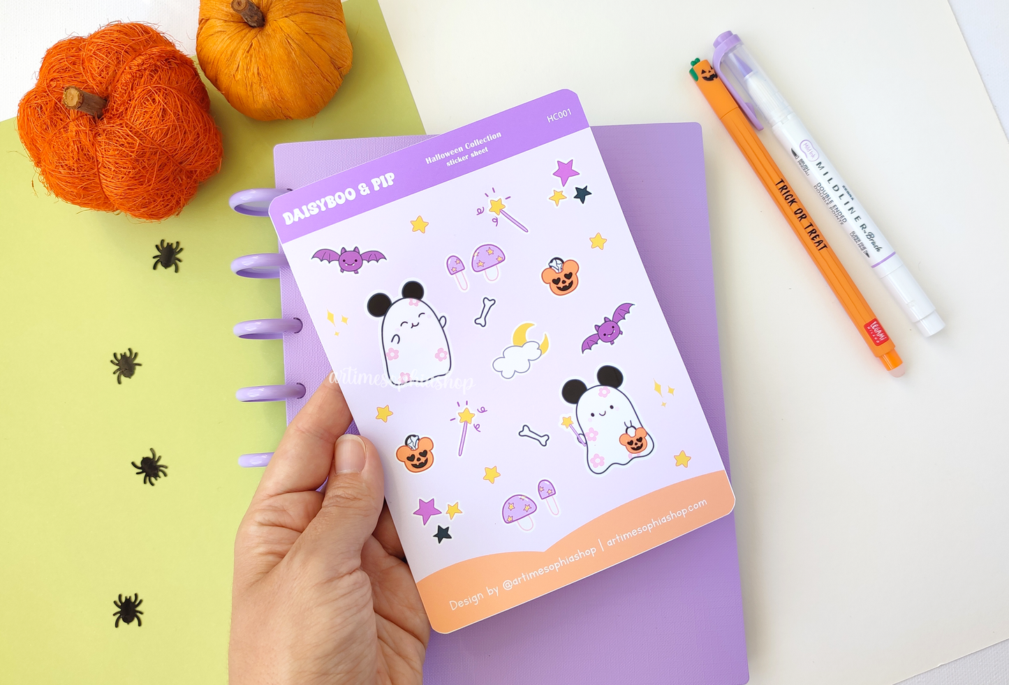 Halloween-themed A6 sticker sheet featuring Daisyboo the ghost and Pip the bat, with colorful, spooky-cute designs printed on matte premium paper.
