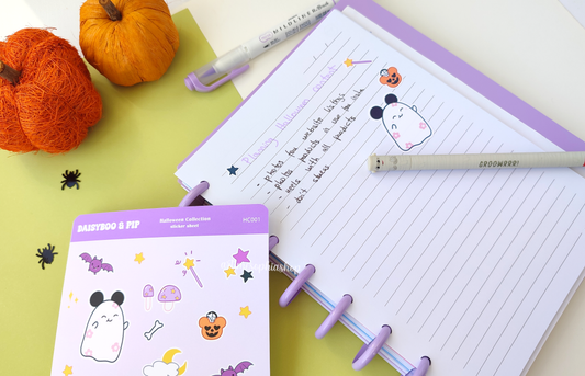 Halloween-themed A6 sticker sheet featuring Daisyboo the ghost and Pip the bat, with colorful, spooky-cute designs printed on matte premium paper.