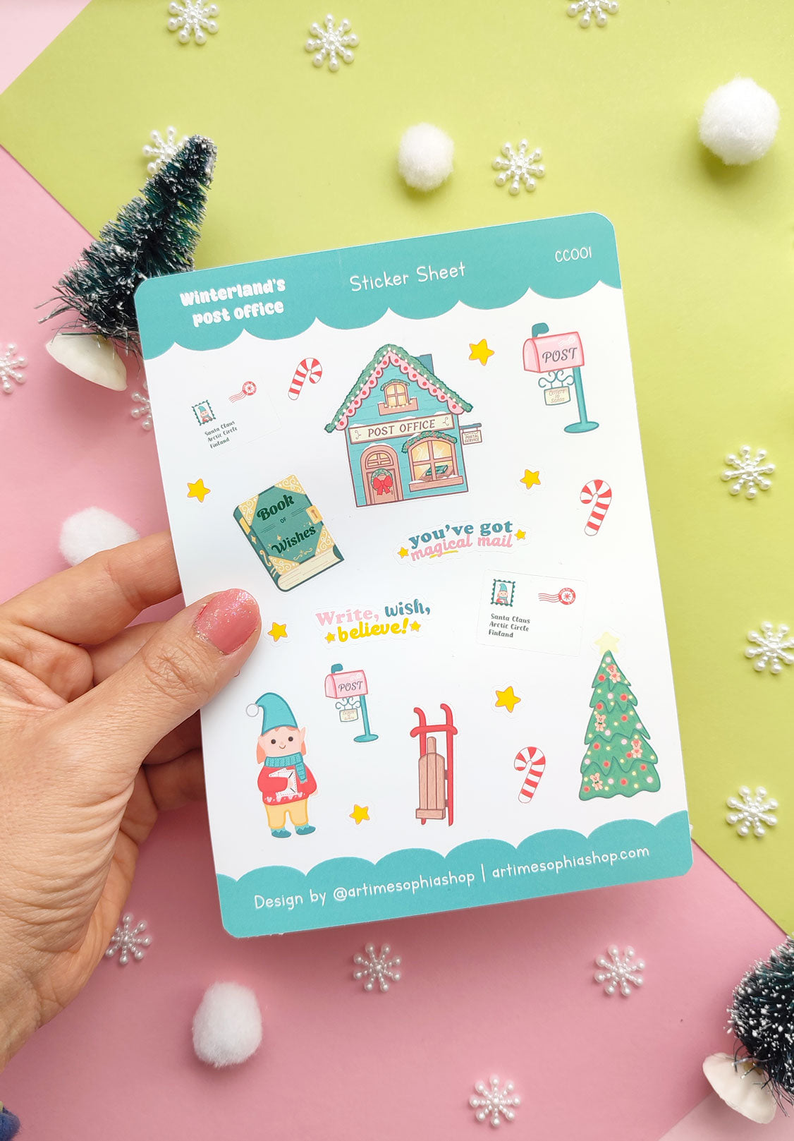 Set of 12 vinyl stickers with matte finish featuring festive illustrations from Winterland, including Elf Ellie, a vintage post office, sleigh, mailbox, and more.