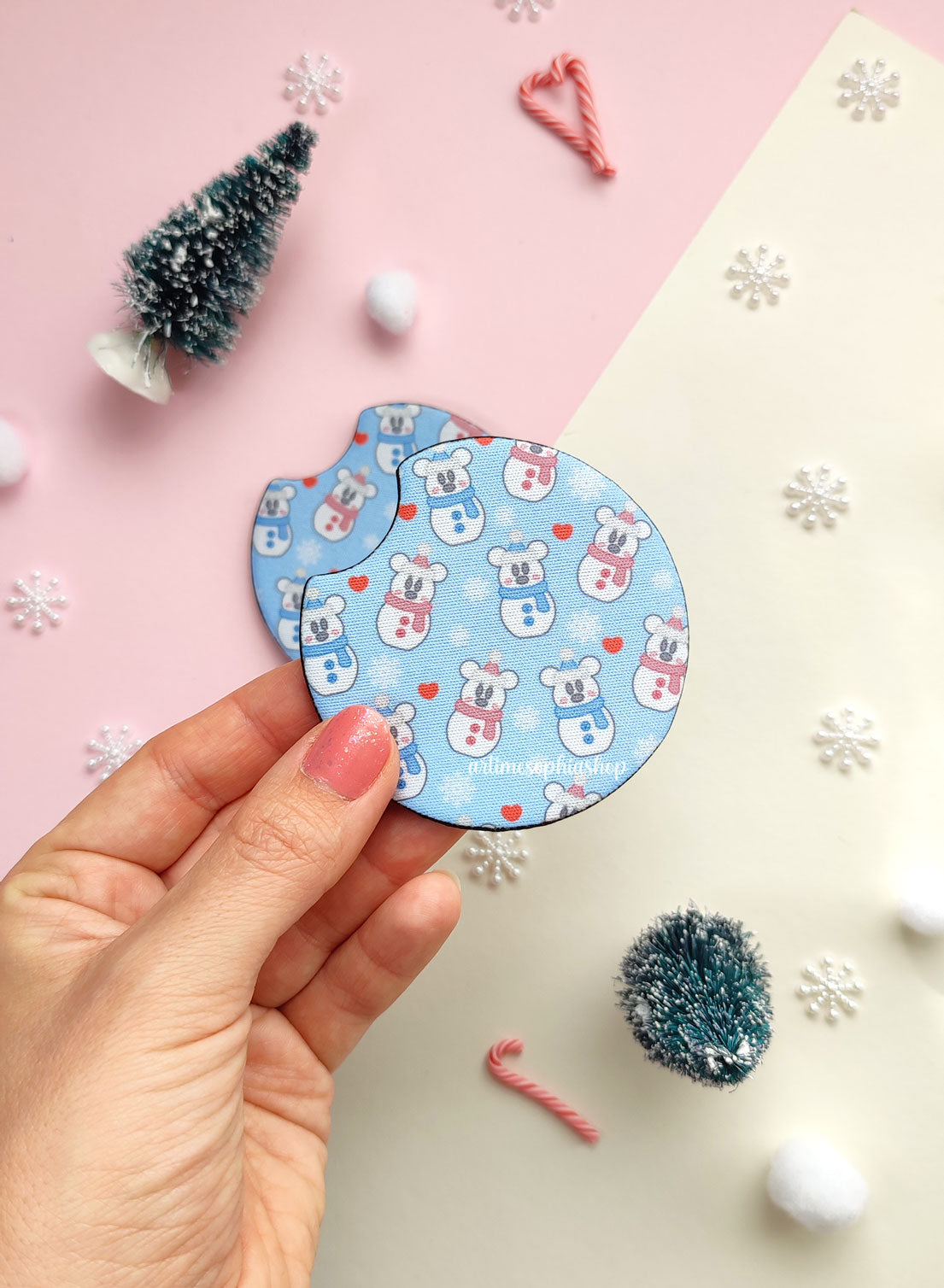 Set of two round car coasters with snowman-style Mickey and Minnie, featuring a festive winter design with soft snowy colors.