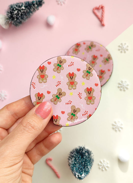 Set of two round car coasters featuring gingerbread Mickey and Minnie designs with festive holiday colors and cute cookie details.