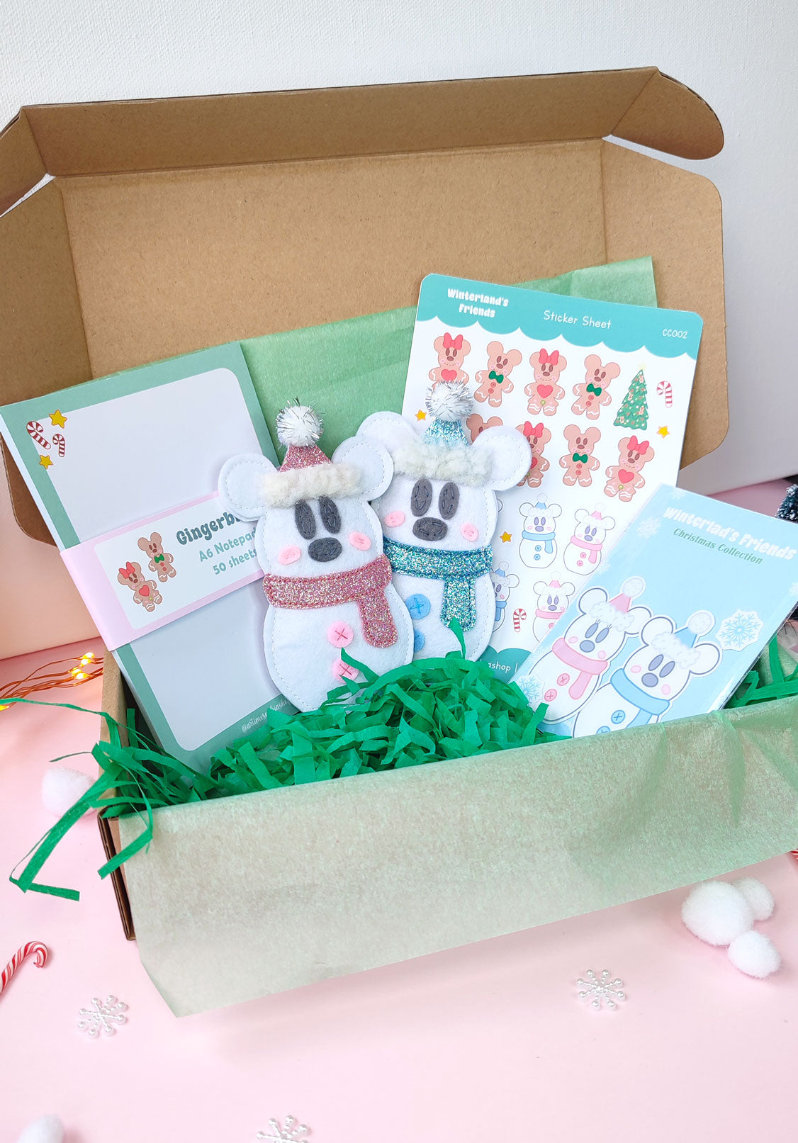 Christmas gift bundle featuring Snowmice Mickey & Minnie felt ornaments, holiday-themed notepad, and two festive sticker sets with cozy winter designs.