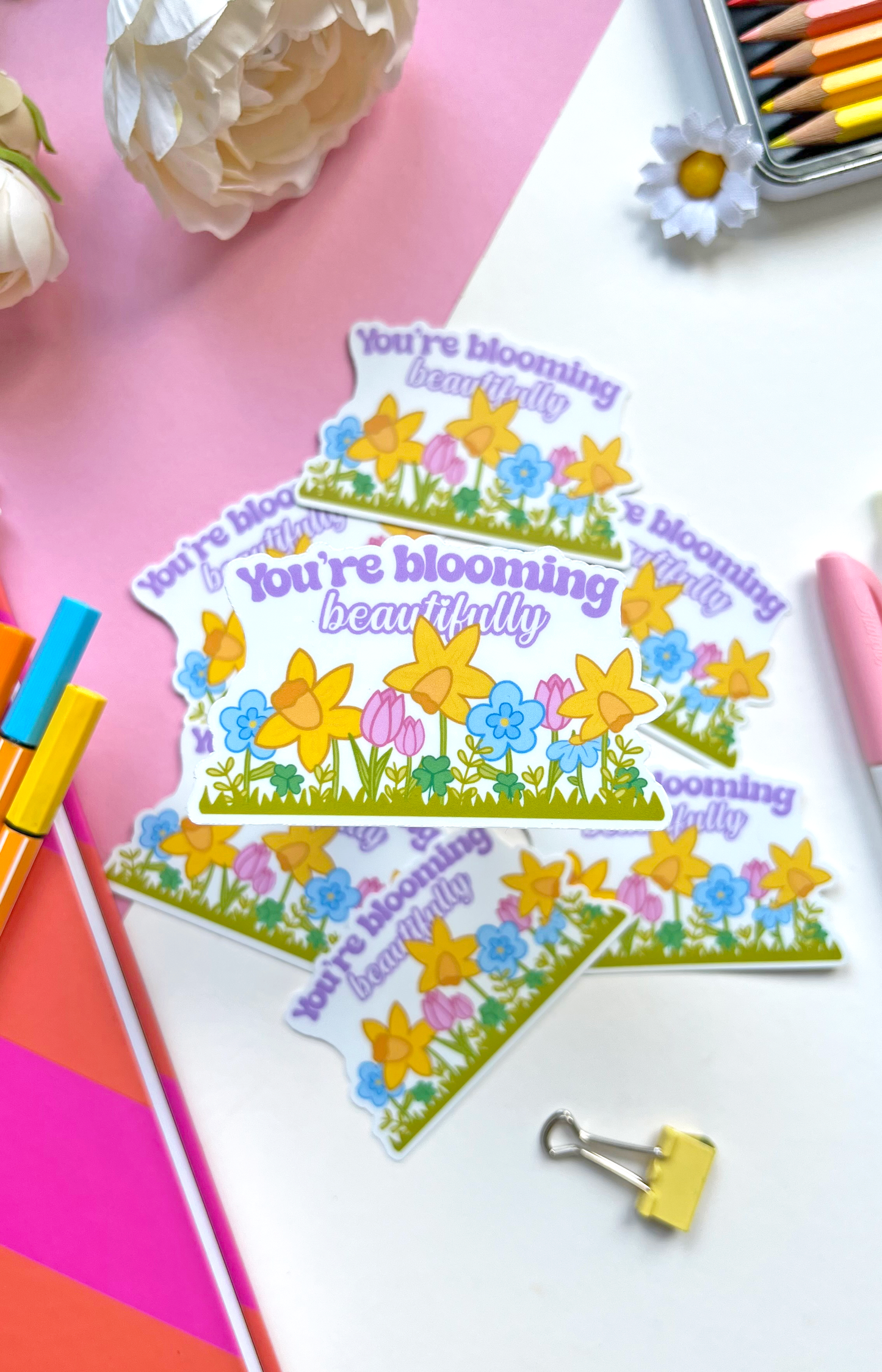 Waterproof vinyl sticker with pastel flowers and the uplifting message “You’re Blooming Beautifully” — perfect for journals, bottles, or laptops.