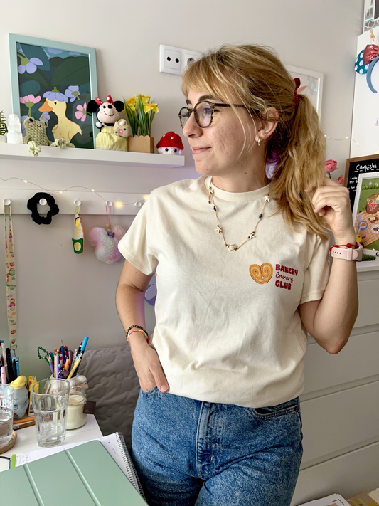 Cream T-shirt with a small Bakery Lovers Club illustration on the front