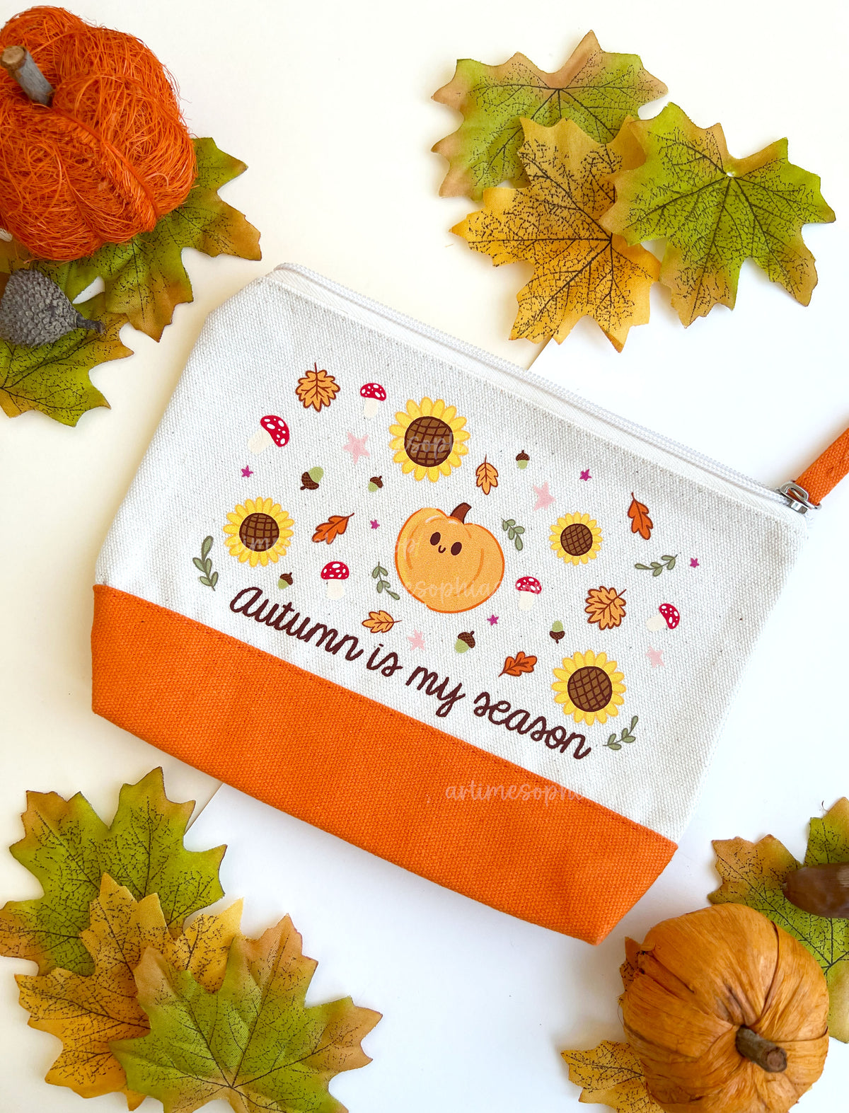 Close-up of Autumn Is My Season pouch featuring pumpkins, sunflowers, mushrooms and autumn leaves.