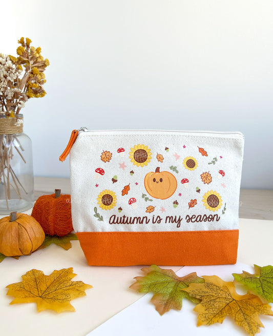 Small cotton canvas pouch with orange base and autumn illustration with pumpkins, leaves and mushrooms