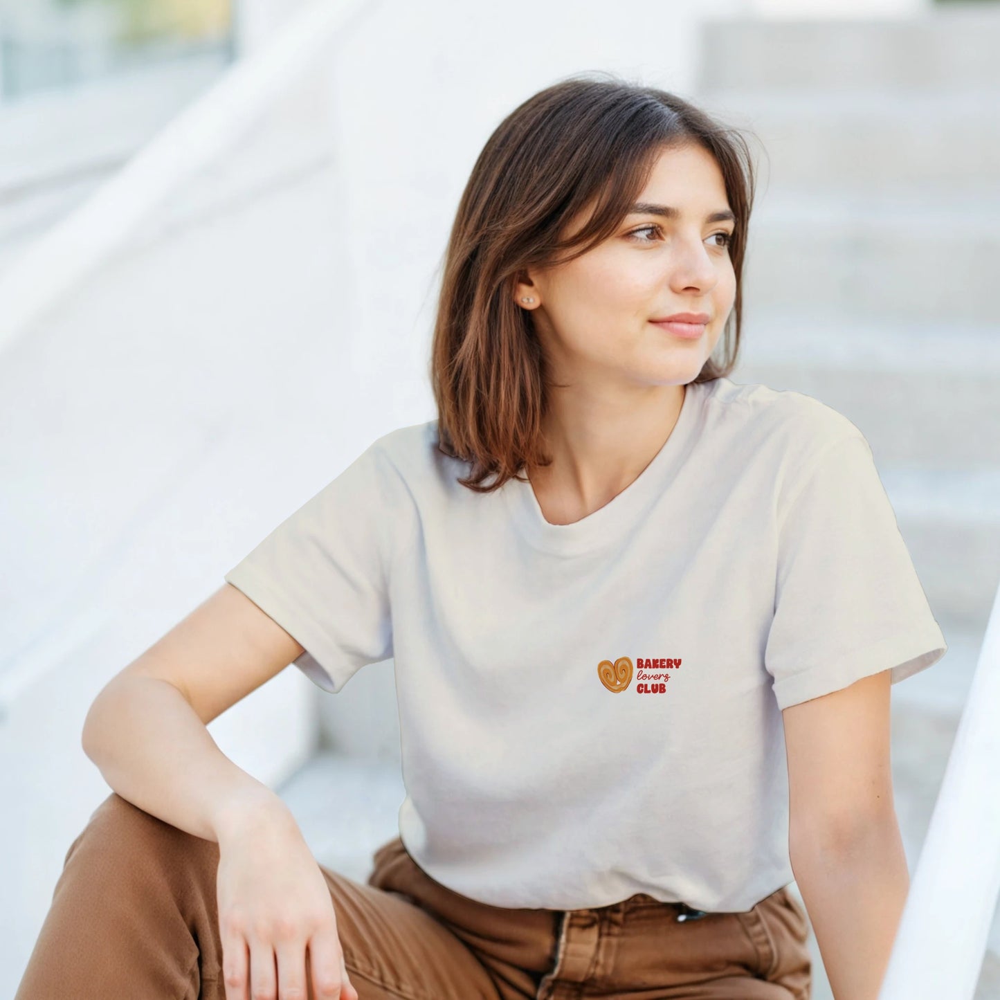 Cream T-shirt with a small Bakery Lovers Club illustration on the front