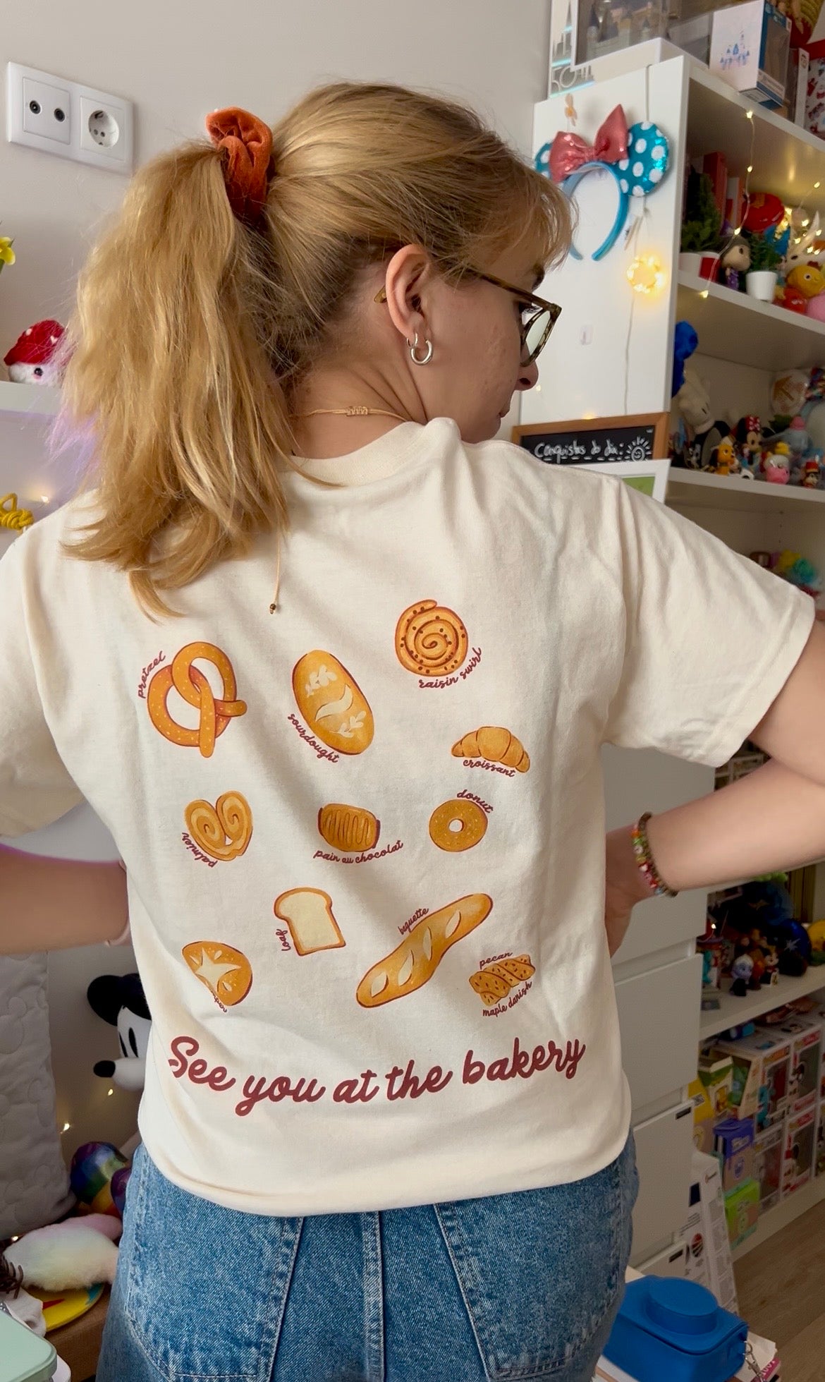 Cream T-shirt with a small Bakery Lovers Club illustration on the back