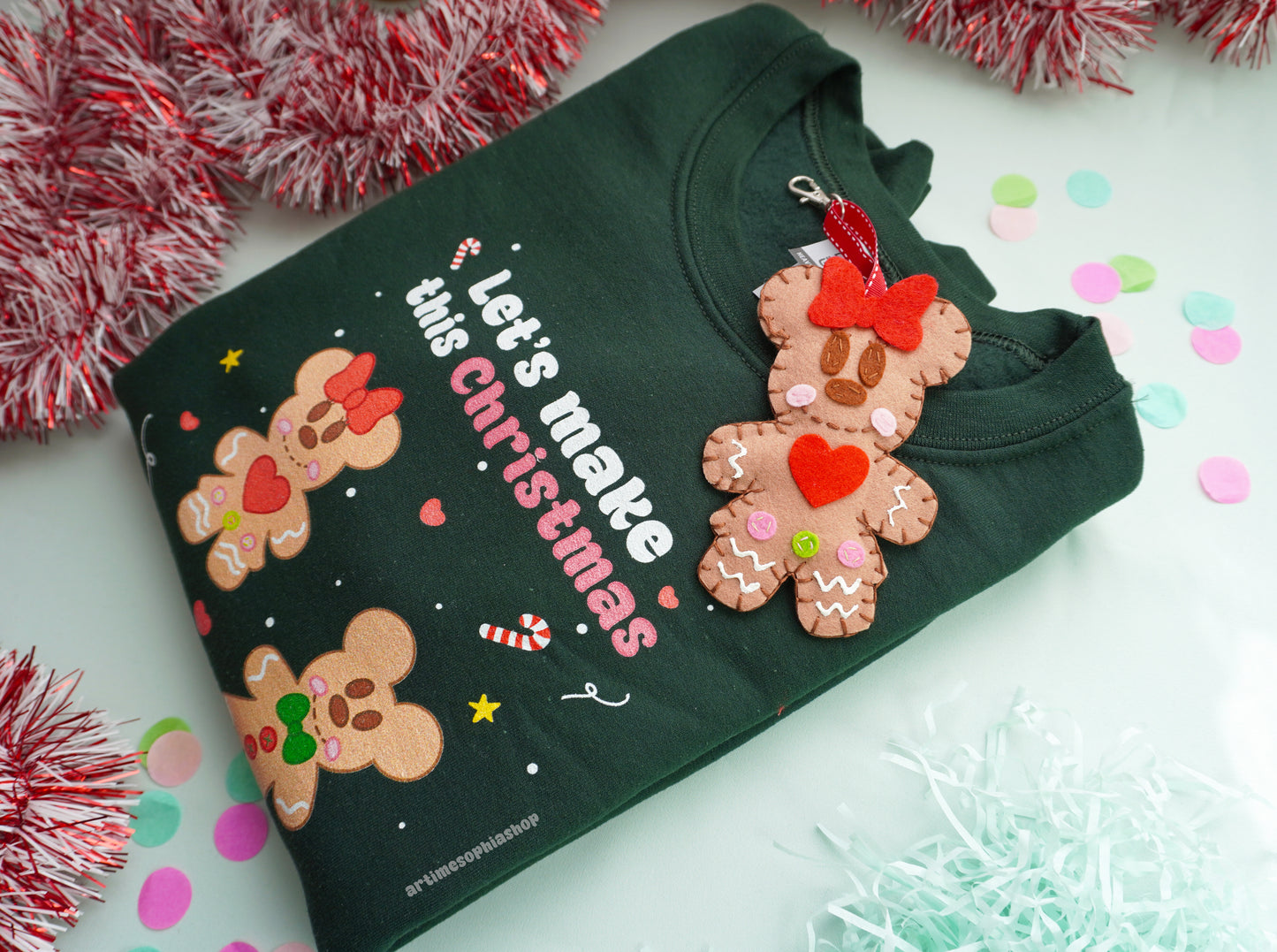 Bring the sweetness of Christmas to life with this cosy and magical Gingerbread Holiday Bundle — a heart-warming set that combines a Disney-inspired sweatshirt with two handmade felt ornaments of Mickey and Minnie as gingerbread cookies