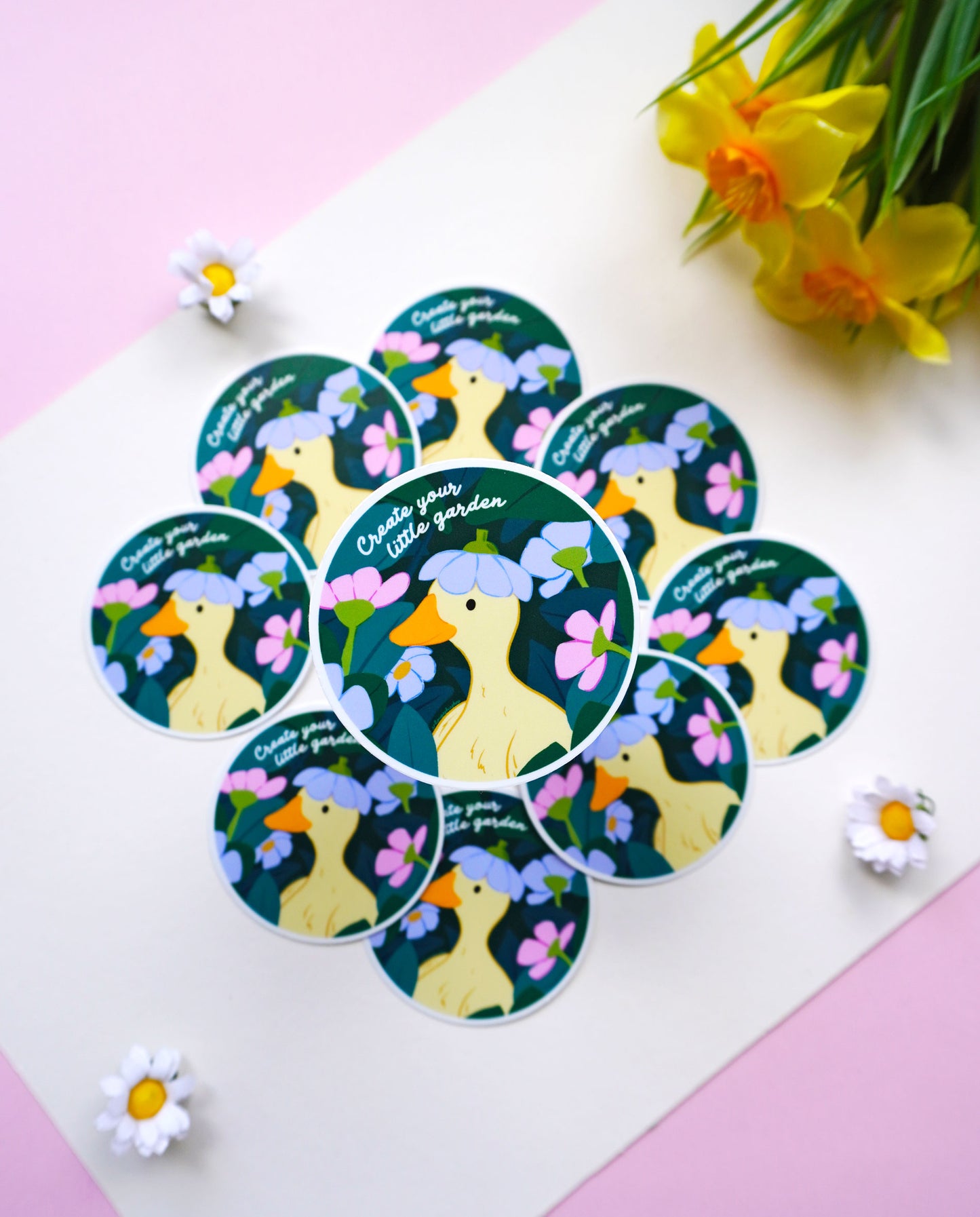Round vinyl sticker featuring a duck and the phrase Create Your Little Garden