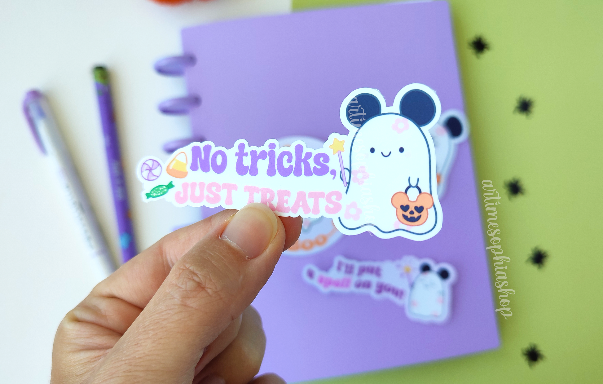 Waterproof Halloween die cut sticker featuring Daisyboo the ghost with the phrase "No tricks, just treats" in a pastel spooky-cute style.