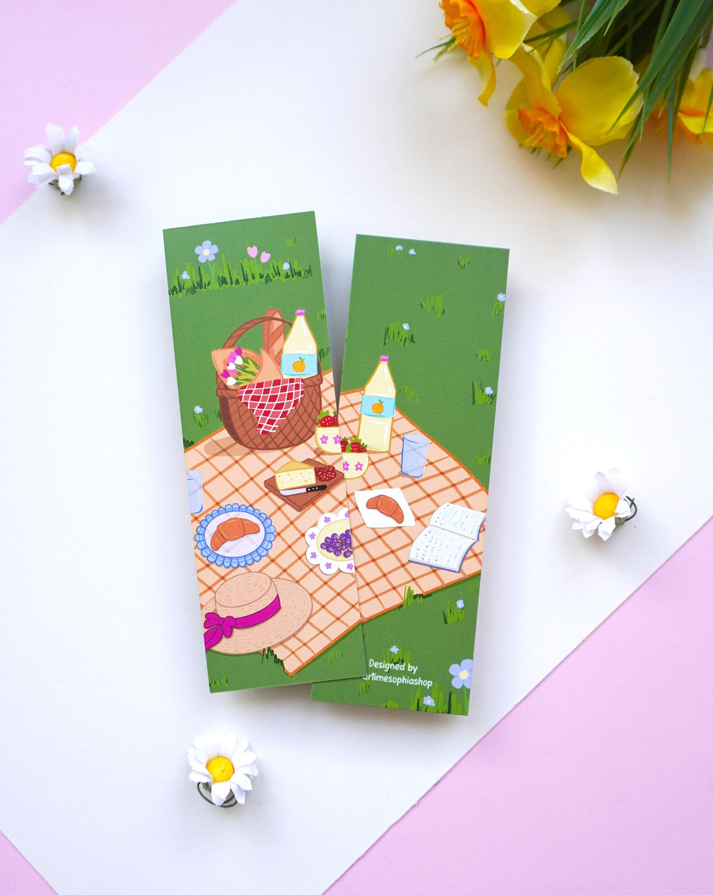 Bookmark featuring a whimsical garden picnic illustration with flowers and cosy details