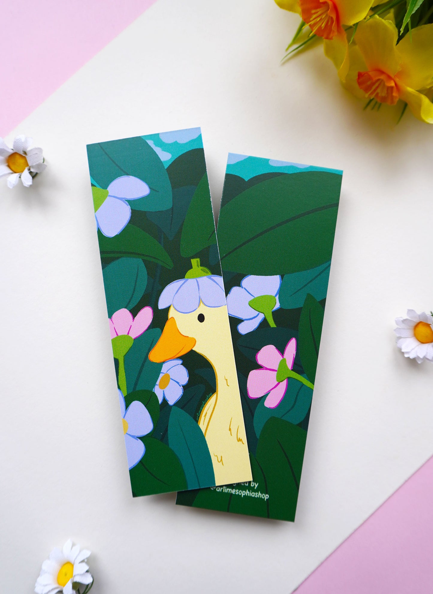 Bookmark featuring a whimsical garden picnic illustration with flowers and cosy details
