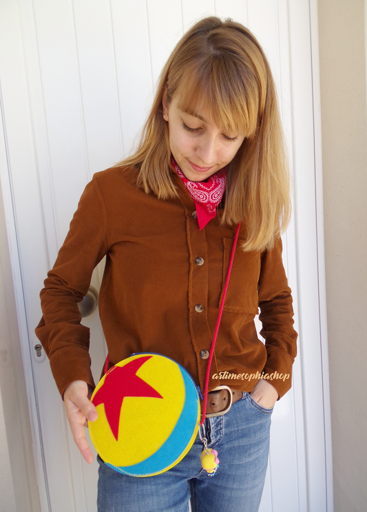 A cute felt purse, inspired by the pixar ballperfect for Disney fans, Disneybounding, or carrying your small everyday essentials.