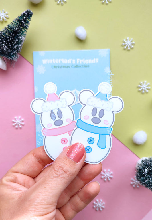 Festive sticker pack featuring snowman-style Mickey and Minnie in cozy winter outfits, printed on vinyl with soft snowy colors and holiday charm.
