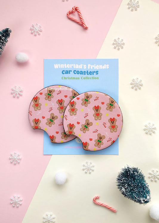 Set of two round car coasters featuring gingerbread Mickey and Minnie designs with festive holiday colors and cute cookie details.