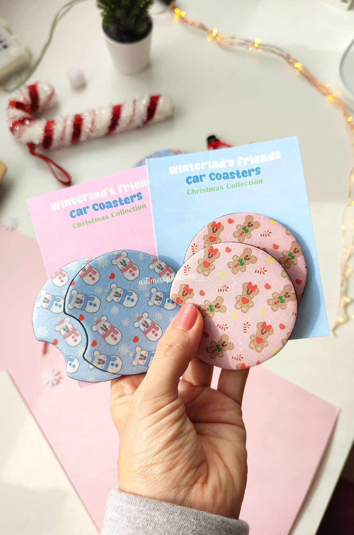 Set of two round car coasters featuring gingerbread Mickey and Minnie designs with festive holiday colors and cute cookie details.