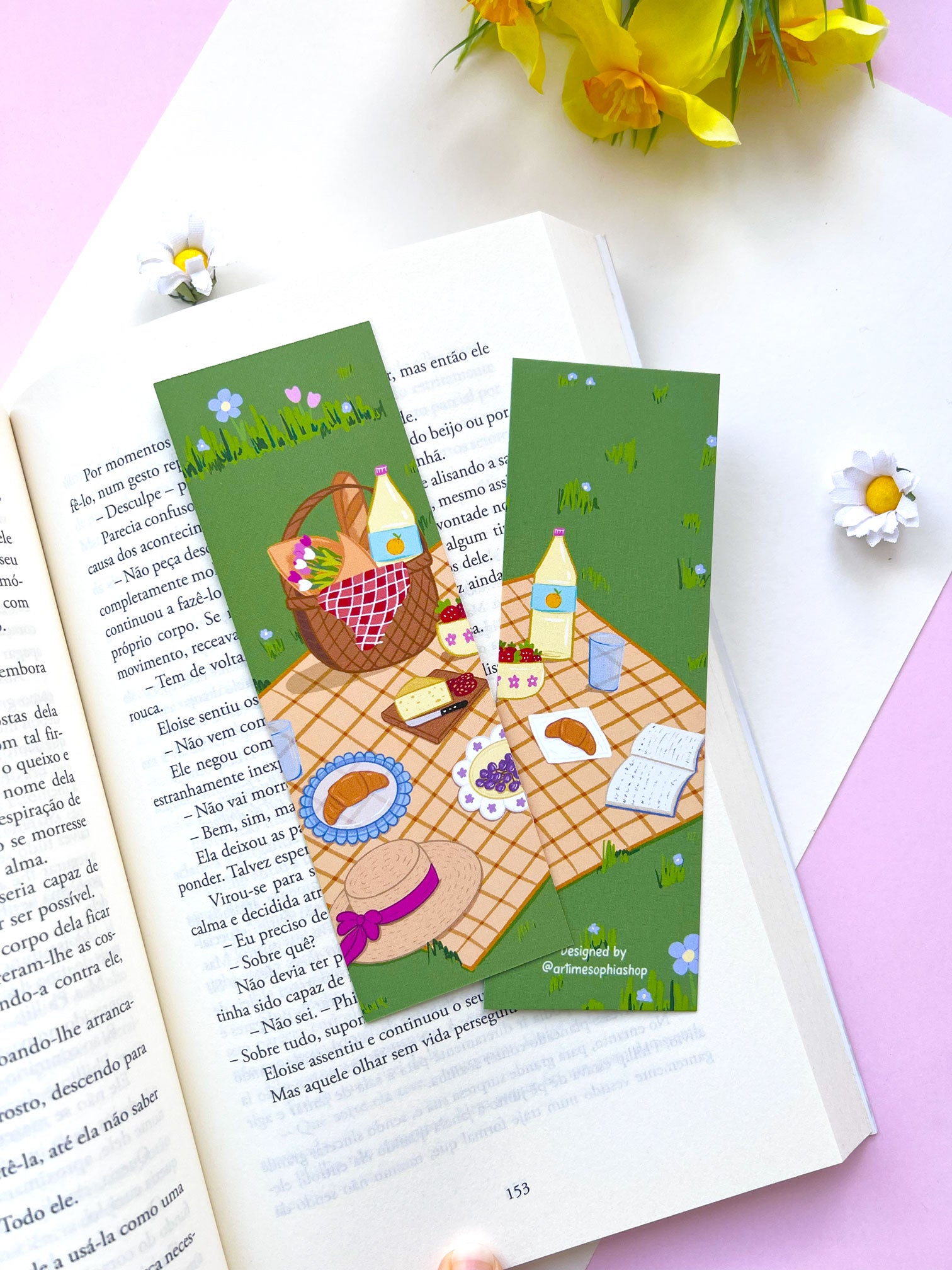 Cute garden picnic bookmark displayed inside an open book
