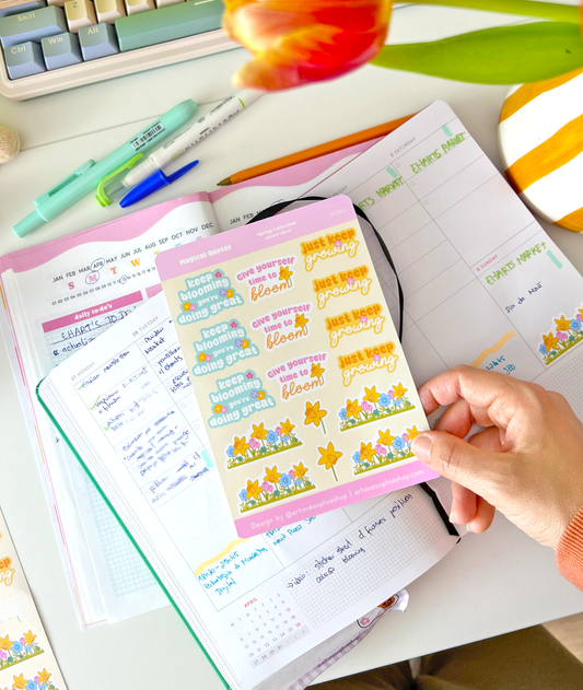 Journaling setup with groovy motivational stickers in use