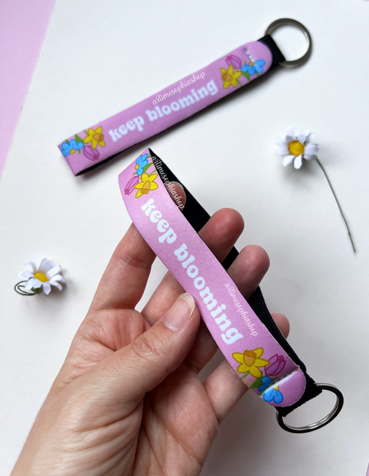 Close-up of pink neoprene wrist keychain with metal ring
