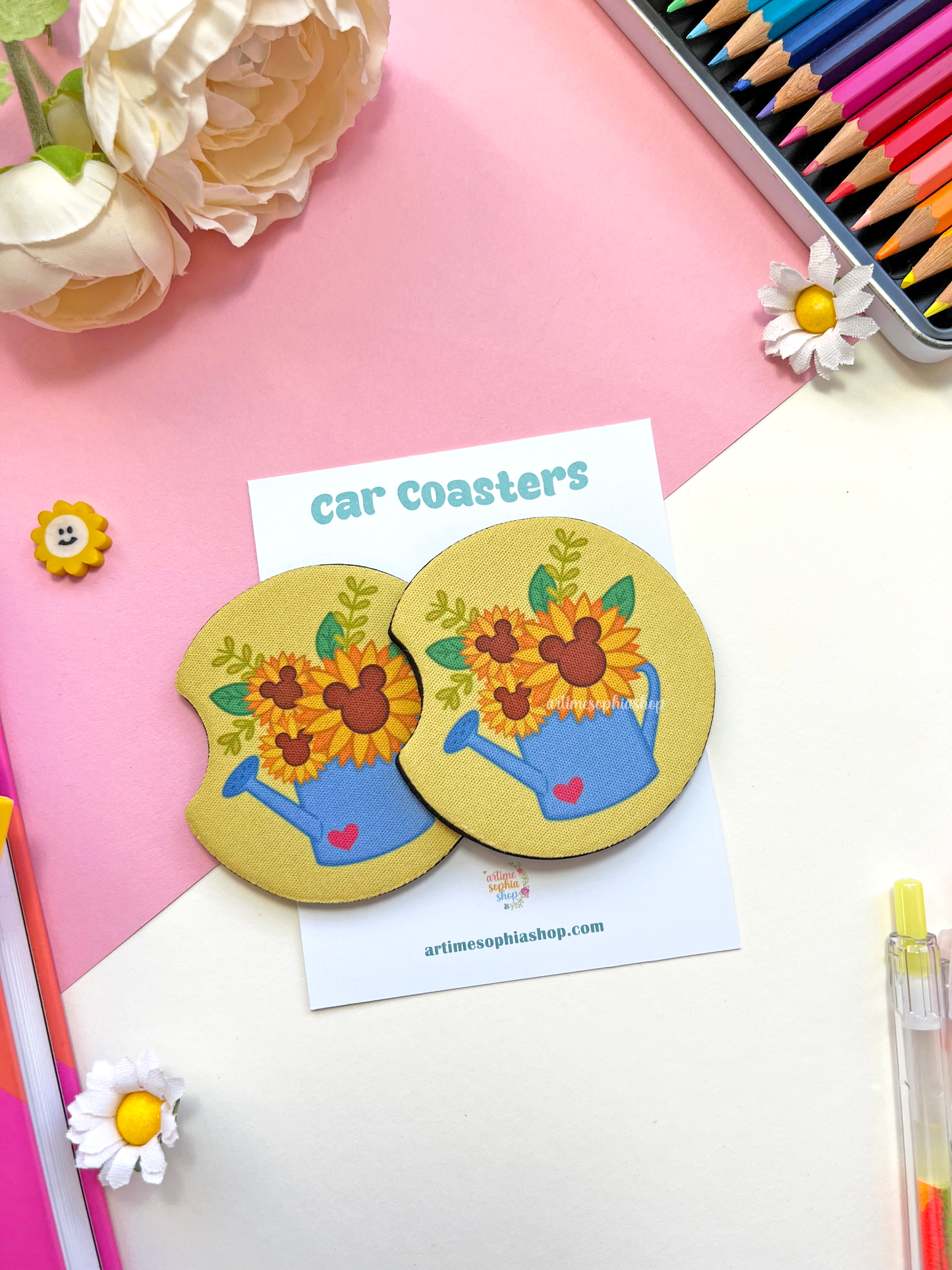 Set of two round sunflower car coasters with bright yellow petals and hidden Mickey details, made of neoprene for a clean and colorful car interior.