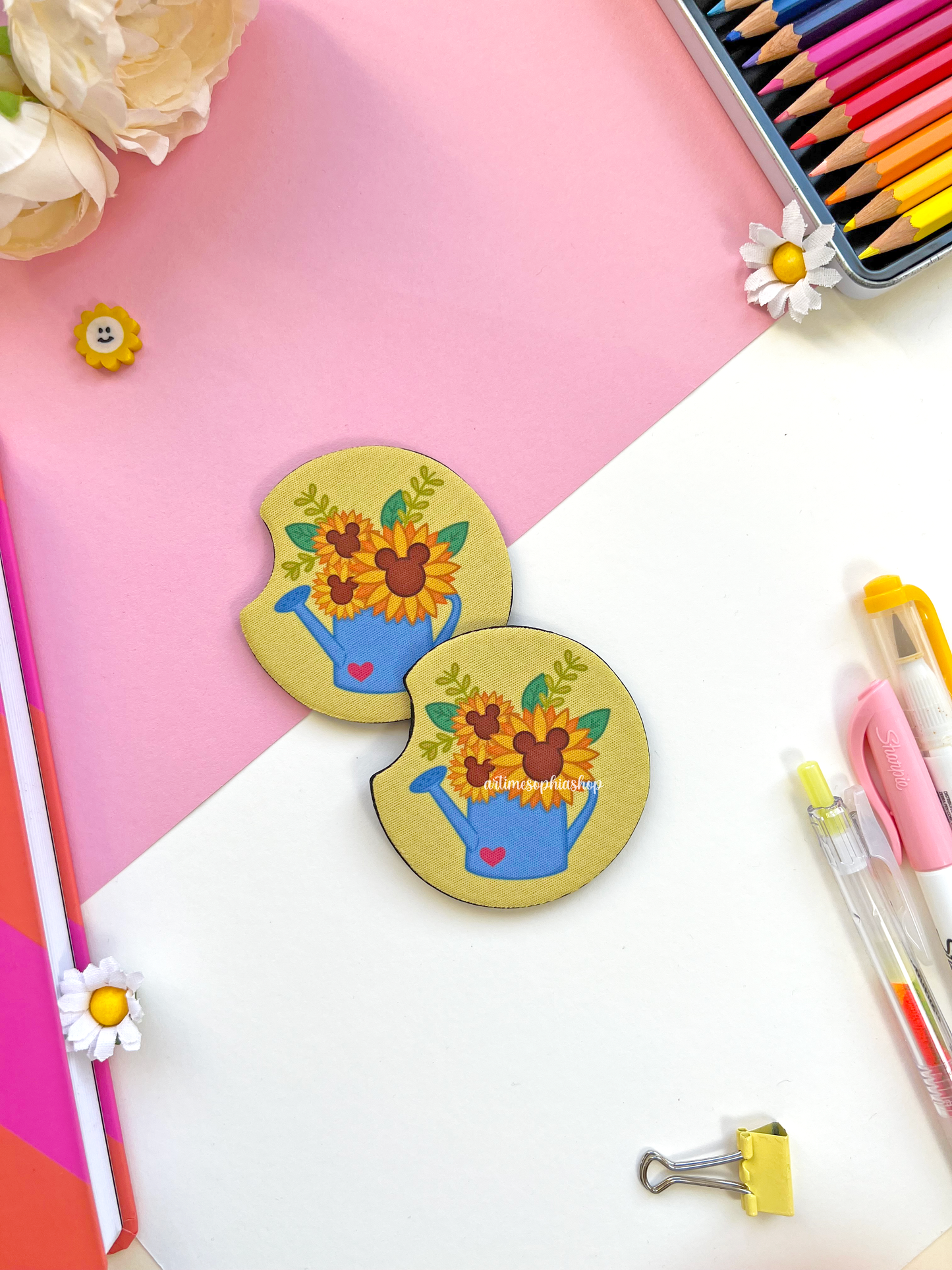 Set of two round sunflower car coasters with bright yellow petals and hidden Mickey details, made of neoprene for a clean and colorful car interior.