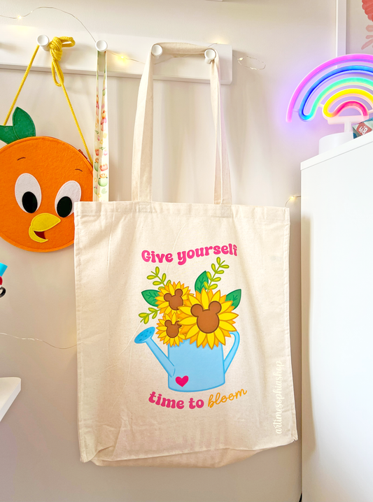 A soft and sustainable tote bag with a positive message: “Give yourself time to bloom”. Handmade in my atelier with 100% cotton and durable DTF design