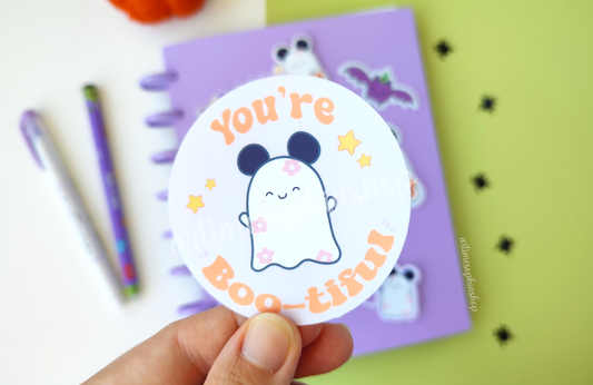 Waterproof die-cut sticker featuring Daisyboo and the phrase “You're Boo-tiful!” in a Halloween-themed, pastel illustration with a cute ghost character.